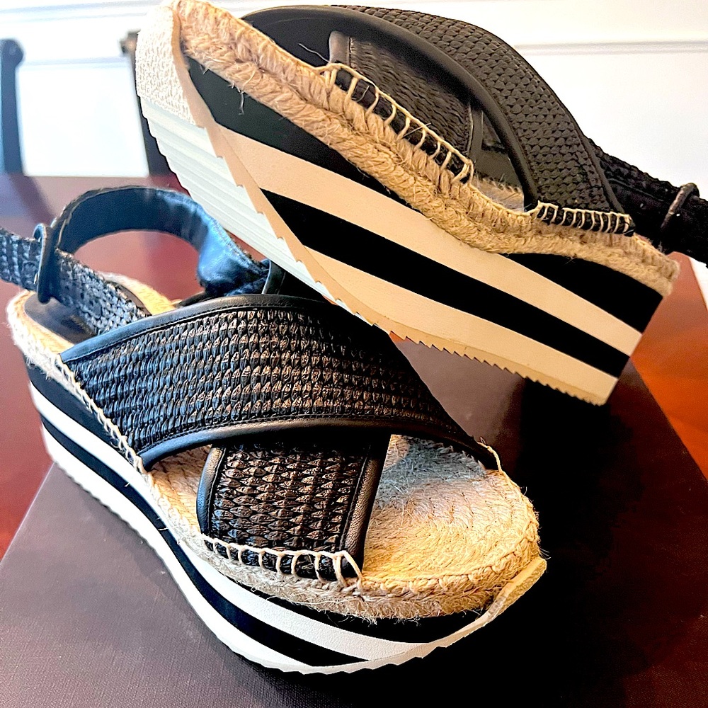 Sandals with wedge heels. Never worn. Very light weight and comfortable.